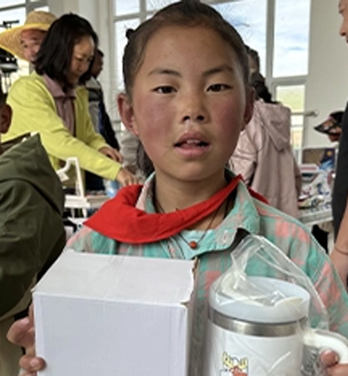 Happy kids receiving personalised bottles