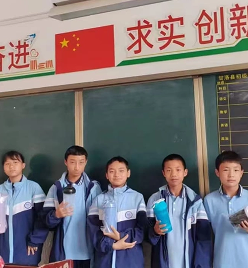 Children holding custom water bottles