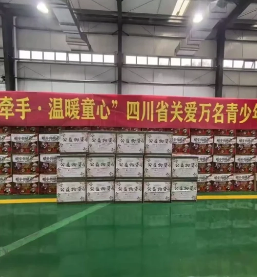 Stacked cartons marked for charity delivery